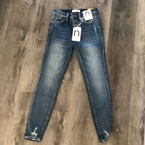 Dark wash jeans with fraying